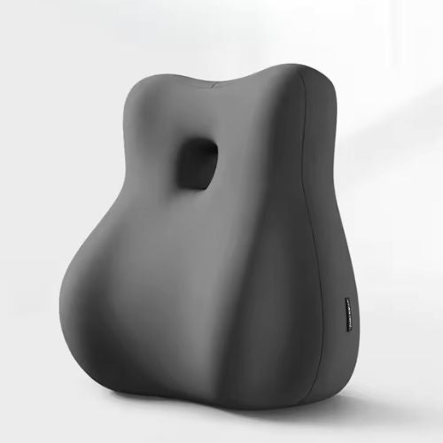 The Todle Couple Pillow, a black contoured memory foam cushion with a central hole for ergonomic couple's support, stands upright against a plain light background.